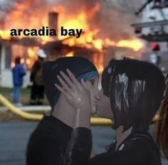 two people kissing in front of a fire with the caption arcadia bay on it