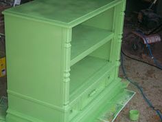 a green dresser is being painted in the process of remodeling it's drawers