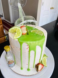 a cake with lime and strawberries on it