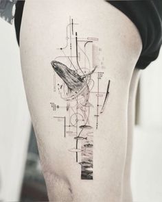 a man's thigh with an abstract tattoo design on the side of his leg