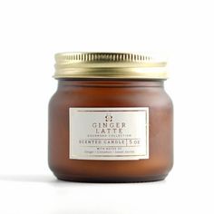 a jar of honey sitting on top of a white table