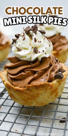 chocolate mini - pies with whipped cream and chocolate chips on top are cooling on a wire rack