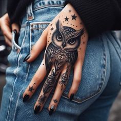 an owl with stars on its hand and some other things in the pocket behind it