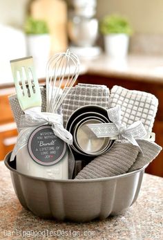 a metal pan filled with kitchen utensils on top of a counter