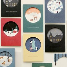 several christmas cards are arranged on a wall