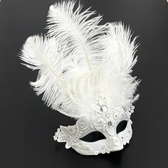 "Be the mysterious white mask at your party with this feathered mask with elastic band. This mask is sure to be a hit at a musical too!" Mask Ball Party, Feathered Mask, White Masquerade Mask, White Masquerade, Mask Ball, Wedding Mask, Mardi Gra, Silver Mask, Feather Mask