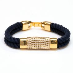 Looking for a little sparkle? Our metallic rope bracelet is the perfect piece to dress up that stack! -Hand dyed navy blue cotton rope -Gold metallic wrap detail -Gold plated spacer beads This bracelet is also available in several other color combinations: Black/Gold https://www.etsy.com/listing/259729254/nautical-rope-bracelet-black-rope?ref=listings_manager_grid Ivory/Gold https://www.etsy.com/listing/242998249/nautical-rope-bracelet-metallic-gold?ref=shop_home_feat_1 Navy/Silver https://www.e Navy Nautical Bracelets As Gift, Navy Nautical Adjustable Bracelets, Navy Adjustable Nautical Bracelet, Adjustable Navy Nautical Bracelet, Adjustable Nautical Style Bracelets For Everyday, Everyday Nautical Style Adjustable Bracelets, Adjustable Nautical Bracelets For Everyday, Adjustable Nautical Style Everyday Bracelets, Adjustable Nautical Style Bracelet For Everyday