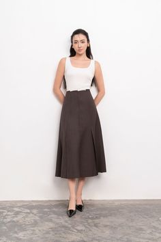 Introducing the midi skirt. Crafted with luxurious linen, this skirt boasts a flattering A-line silhouette and a high waist for a sophisticated and exclusive look. Perfect for all occasions, this skirt combines elegance and comfort effortlessly. Elevate your wardrobe with this must-have piece. *Material: Linen (Beige skirt), Polycotton (Brown skirt) Linen Midi Skirt, Beige Skirt, Mean Blvd, Brown Skirt, Brown Skirts, Linen Skirt, Luxury Linen, Linen Top, Beige Brown