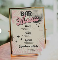 a menu on a wooden table in front of a window with the words bar movi above it