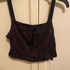 Black Uo Crop Top. Ties In Front, Never Worn. Size L Urban Outfitters Sleeveless Black Crop Top, Black Cotton Tank Top For Day Out, Urban Outfitters Black Crop Top For Summer, Urban Outfitters Black Casual Crop Top, Black Urban Outfitters Crop Top For Summer, Trendy Black Urban Outfitters Crop Top, Black Cropped Tops By Urban Outfitters, Black Cropped Top From Urban Outfitters, Urban Outfitters Black Tank Top For Spring