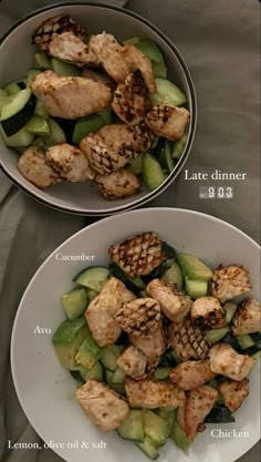 two white bowls filled with chicken and cucumber salad on top of a table