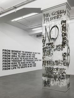 an art installation with black and white graffiti on the walls