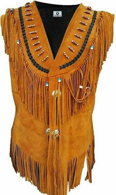 women western Native Americans Suede Leather Vest New Style Description: 100% Suede Leather  The jacket is made of grade A cow Suede leather.  Heavy and soft lea High quality workmanship Excellent fringe and bead work on the coat Hand Made Stitching World wide Shipping Women western Suede Leather vestSizing: All Sizes are available Take your measurements and refer to the size chart before you order Native American Style Outfits, Native American Vest, Cowgirl Fringe, Cowboy Vest, Clothing Tape, Cowboy Jacket, Western Vest, Indian Women Fashion, Celebrities Fashion