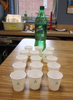 the cups are lined up on the table and ready to be filled with water or soda