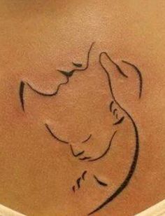 a woman's stomach with a tattoo on it