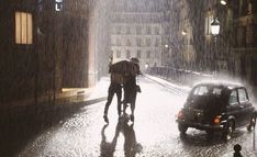 two people walking down the street in the rain