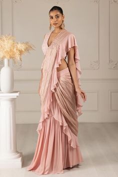 Peach pre-draped ruffle trim saree with placement embroidery work. Paired with a floral butti embroidered blouse. - Aza Fashions Fitted Draped Blouse With Ruffles, Placement Embroidery, Ruffle Sarees, Ruffle Saree, Drape Saree, Embroidery Floral, Blouse For Women, Fashion App, Saree With Blouse