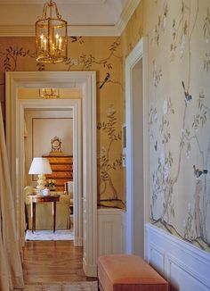 the hallway is decorated with wallpaper, curtains and a bench in front of it