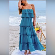 Cupshe Brand New Never Worn Size Medium Bust:35.5-37.5in Waist:27.2-29.2in Hip:38.2-40.2in Dance Into Summer With Our Ruffled Tiered Maxi Tube Dress! Featuring Cascading Tiers Of Playful Ruffles, This Dress Exudes Bohemian Charm And Carefree Elegance, Perfect For Twirling Through Sunny Days And Warm Nights With Style And Grace. Product Code: Caa05a4e054tt Features: Woven Straight Neckline Sleeveless & Strapless Tiered Flounce Bodice Micro-Ruffle Detail Maxi Material: 100%Polyester Summer Beach Dress With Ruffled Skirt, Beach Sundress With Ruffles And Midi Length, Beach Midi Sundress With Ruffles, Ruffled Midi Sundress For Beach, Fitted Ruffle Maxi Dress For Beach Season, Party Ruffle Maxi Length Sundress, Fitted Maxi Dress With Ruffles For Beach Season, Maxi Length Ruffled Sundress For Party, Beach Season Party Maxi Dress With Ruffles