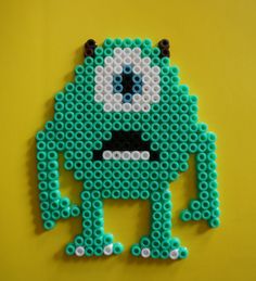 an image of a green monster made out of legos on a yellow background with the text perler bead patterns