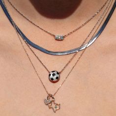 Score major style points when you wear the Soccer Silver Short Pendant Necklace in Ivory Mother-of-Pearl. A shimmering soccer ball pendant complete with gunmetal detailing, this sporty style brings the spirit to every game. Also available in gold! Metal: Rhodium Over Brass Material: Ivory Mother-Of-Pearl Closure: Lobster Clasp W/ Single Adjustable Slider Bead Size: 19"Chain, 0.51"L X 0.49"W Pendant Due to the one-of-a-kind nature of the medium, exact colors and patterns may vary slightly from th Soccer Necklace, Tech Accessories Gadgets, Dune Jewelry, Short Pendant Necklace, Silver Shorts, Kendra Scott Necklace, Ball Pendant, Brass Material, Summer Accessories