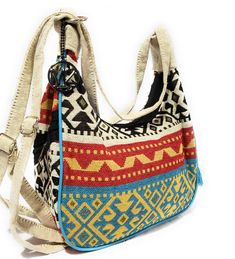 Tapestry Imported Adjustable and thoughtful Strap design to use it as Shoulder, Crossbody and a Backpack bag Two side zipper pockets with evil eye beads décor and one main Zipper compartment Breathable inner lining. -- MariaKinz Hobo bags are made of tapestry fabric. It can be used as Crossbody, Shoulder and backpack with adjustable strap Ethnic design pattern with two Zipper Pockets on the side and evil eye pocket hang beads. One main zipper pocket and inner breathable lining. Multicolor Hobo Bag With Zipper For Travel, Bohemian Multicolor Shoulder Bag With Zipper Pocket, Bohemian Travel Bag With Detachable Strap, Multicolor Bohemian Bags For Trip, Bohemian Multicolor Shoulder Bag For Trip, Bohemian Hobo Bag With Detachable Strap For Travel, Bohemian Shoulder Bag With Cell Phone Pocket For Travel, Bohemian Shoulder Bag With Zipper Pocket For Travel, Bohemian Crossbody Bag With Zipper Pocket