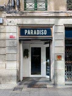 an entrance to a building with the name paradiso on it's front door