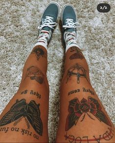 someone has tattoos on their legs and feet