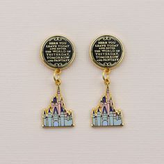 the disney castle earrings are on display