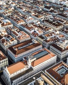 an aerial view of the city with many buildings in it's foregrounds