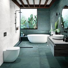 a bathroom with two sinks and a bathtub in the middle, surrounded by greenery