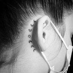 a woman's ear with the word love written in cursive writing on it