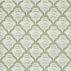 a green and white wallpaper with scallop shells on it's side