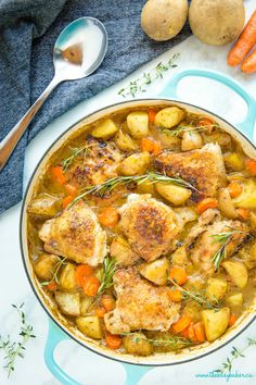 chicken stew in a pot with carrots and potatoes