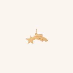 Make a wish or give a wish. The Shooting Star charm captures the eye with its distinctive shape and symbolic meaning Pair with our Cable chain or Flow necklaces, wear solo or complement with other ela charms. - Coated in 18K gold (2.5 microns) - Brass Base - Length: 20 mm - Width: 5 mm - Bail Size: 5 mm JEWELRY CARE As with all metals, special care must be taken to ensure they do not scratch or tarnish over time. Follow these simple steps to keep your pieces looking their best:Avoid direct contact when applying cosmetics, perfumes, sprays, creams and oils. Store jewelry in a clean, dry place away from natural sunlight, humidity and heat. Each piece should be stored individually in an air-tight pouch (especially sterling silver and gold vermeil to prevent oxidation, tarnishing and scratchin Tarnish Remover, Store Jewelry, Natural Sunlight, Shooting Star, Shooting Stars, Star Charms, Make A Wish, Cable Chain, Jewelry Care