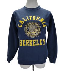 Blue Retro Sweatshirt For Sports, Blue Collegiate Sweatshirt For Campus, Blue Graphic Print Sweatshirt For Campus, Vintage Blue Sweatshirt For Sports, Retro Blue College Sweatshirt, Retro Blue Sweatshirt For College, Blue Retro Sweatshirt For College, Vintage Blue Sweatshirt For College, Vintage Blue Sweater For College