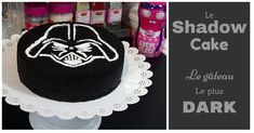 a darth vader cake with white frosting and the words le shadow cake