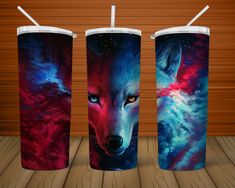 three colorful cups with the same design on them, each containing an image of a wolf