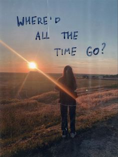 a person standing on a dirt road with the sun setting in the background and text where'd all the time go?