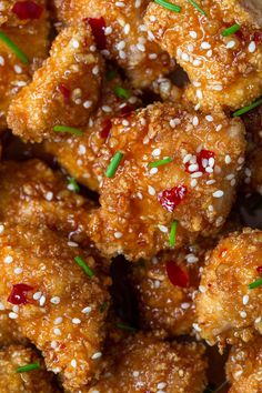 sesame seed chicken is piled high with sesame seeds