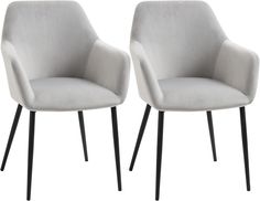 pair of grey upholstered chairs with black metal legs on white back drops