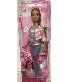 the barbie doll is in its pink box