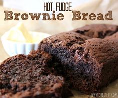 chocolate brownie bread cut in half and sitting on a cutting board with the words hot fudge brownie bread