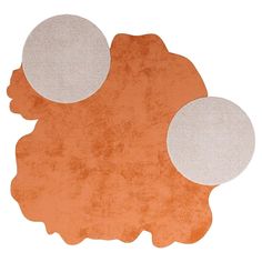 an orange and white rug with three circles on the top, in front of a white background