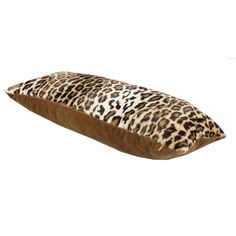 an animal print pillow on a white background with a brown bottom and tan sides, along with a leopard print pattern