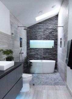 a bathroom with a toilet, sink and bathtub