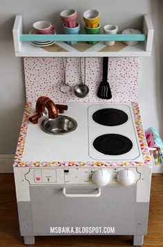 a play kitchen made out of an old stove