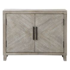 the sideboard is made from wood and has two doors, one with an intricate design on