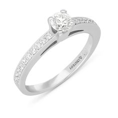 a white gold engagement ring with diamonds on it