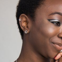 a close up of a person wearing jewelry